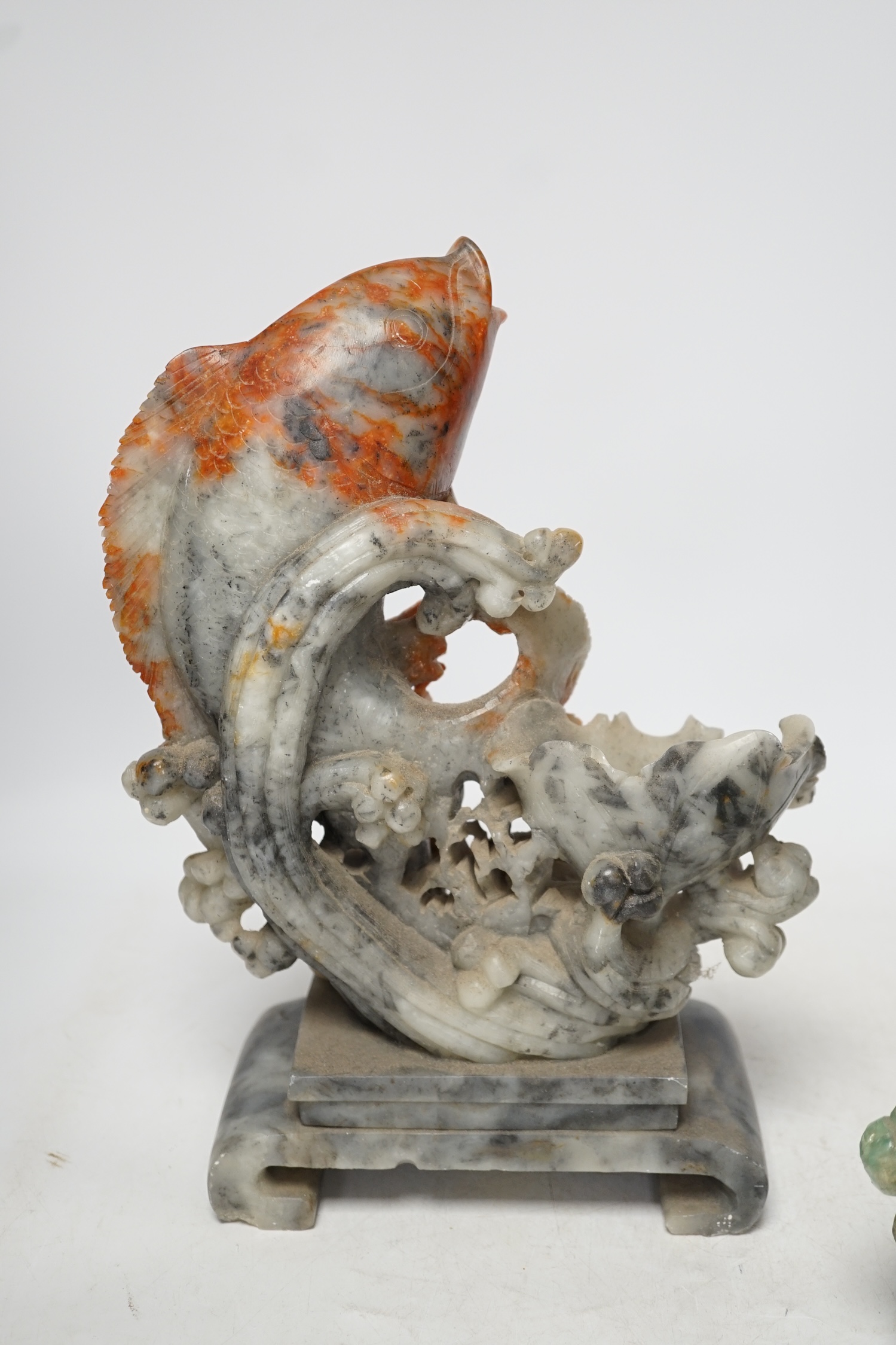 A Chinese carved soapstone figure of a leaping carp and a green quartz pot and cover, tallest 29.5cm high. Condition - fair